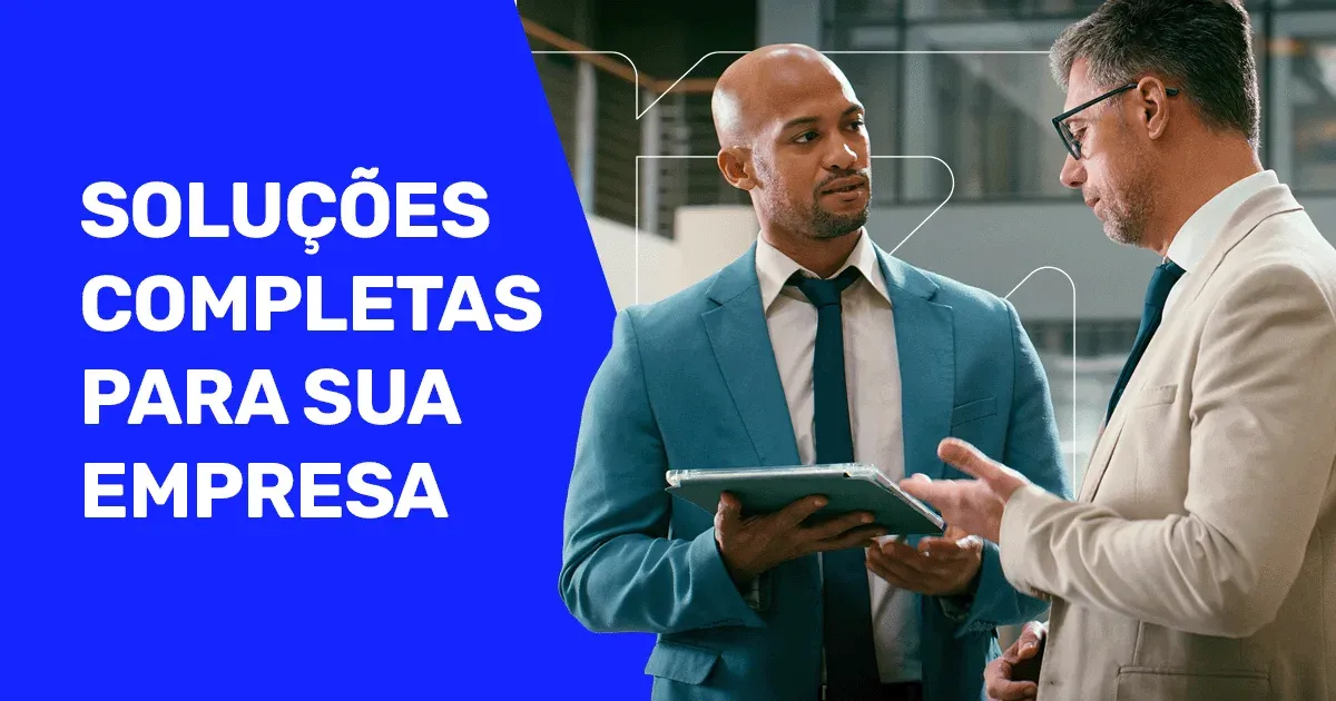 Banner "SOLU&Ccedil;&Otilde;ES COMPLETAS PARA SUA EMPRESA" com dois executivos de terno conversando e usando um tablet no escrit&oacute;rio.